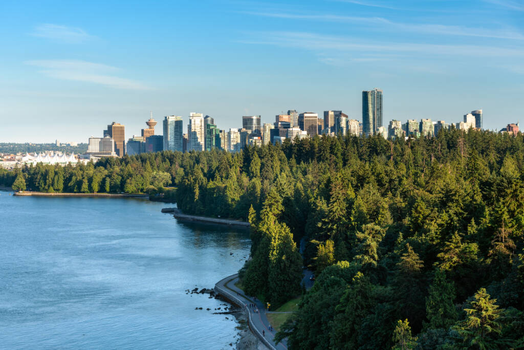 Vancouver skyline framed by forest and ocean, reflecting local death care rooted in place and community